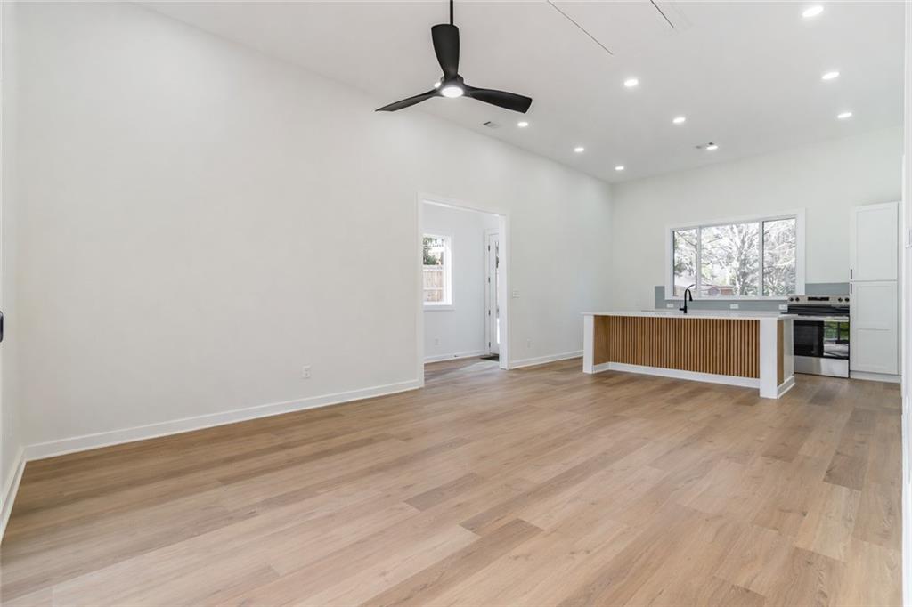 2651 Pangborn Road Decatur, GA 30033 - Photo 26 of 31 a view of kitchen and empty room with wooden floor