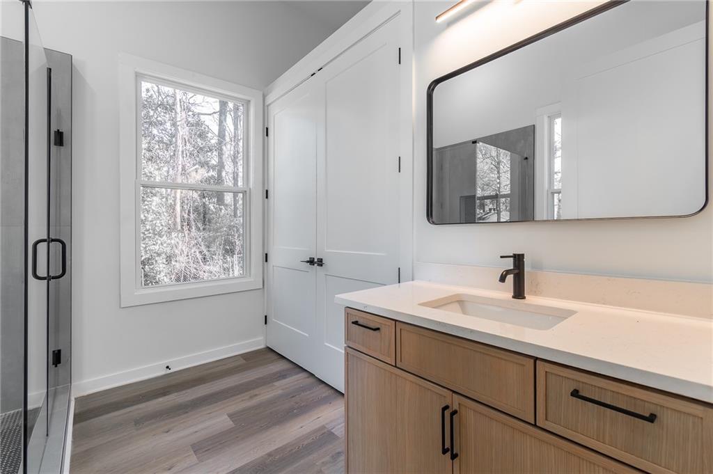 2651 Pangborn Road Decatur, GA 30033 - Photo 29 of 31 a bathroom with a sink a mirror and a window