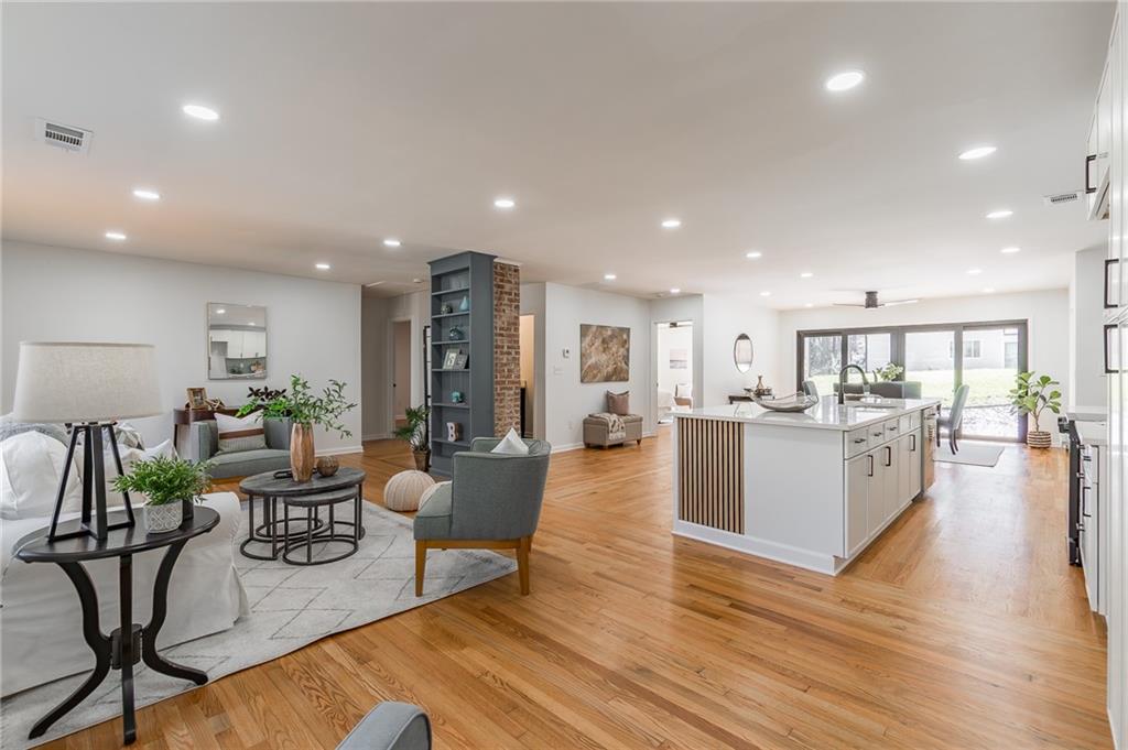 2651 Pangborn Road Decatur, GA 30033 - Photo 3 of 31 a living room with furniture wooden floor and a kitchen view