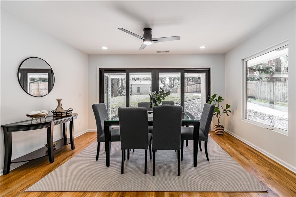 2651 Pangborn Road Decatur, GA 30033 - Photo 4 of 31 a view of a dining room with furniture window and wooden floor