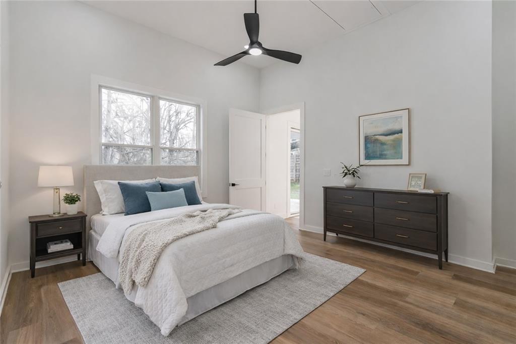 2651 Pangborn Road Decatur, GA 30033 - Photo 8 of 31 a bedroom with a bed and a chandelier