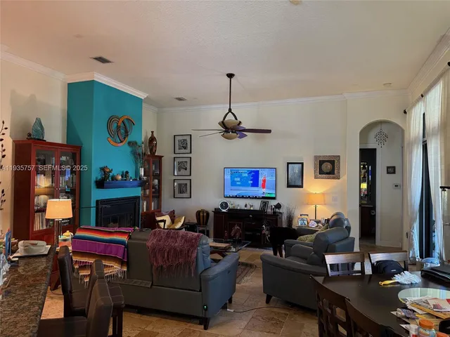 a living room with fireplace furniture and a flat screen tv