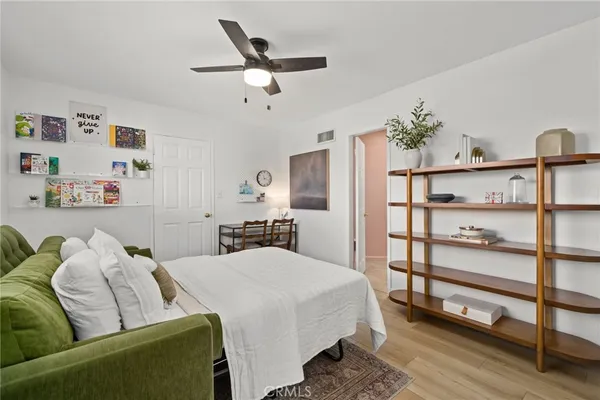 a bedroom with a bed furniture and a window