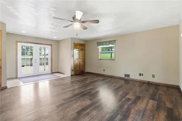 a view of a kitchen with wooden floor and a kitchen