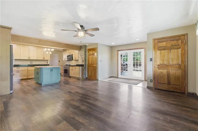 a kitchen with a refrigerator and a sink