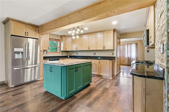 a kitchen with a sink stove and wooden cabinets