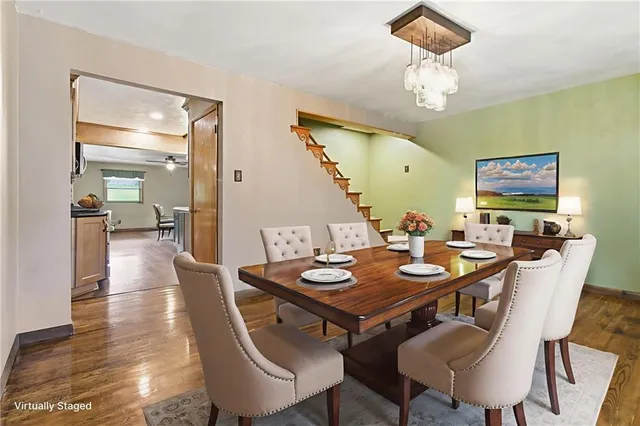 a view of a livingroom with wooden floor