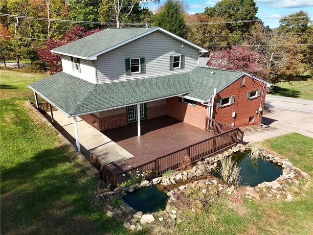 a aerial view of a house with a yard