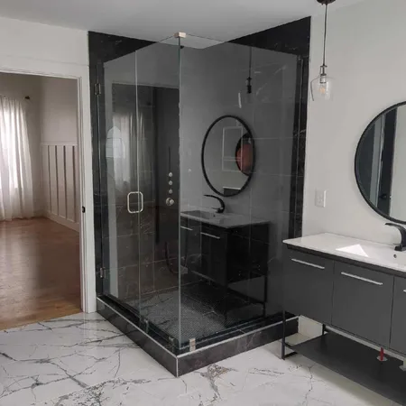 a bathroom with a shower a mirror and a shower