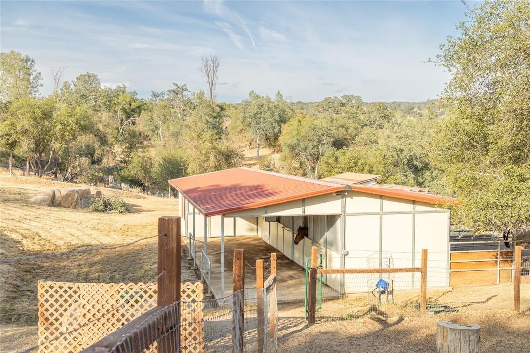 32057 River Knolls Road Coarsegold, CA 93614 - Photo 16 of 73 a view of a balcony with furniture