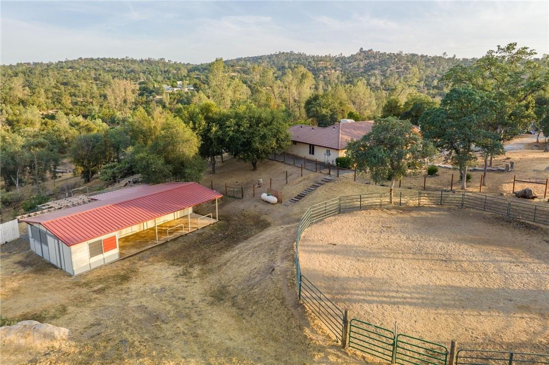 32057 River Knolls Road Coarsegold, CA 93614 - Photo 2 of 73 an aerial view of a house with a yard