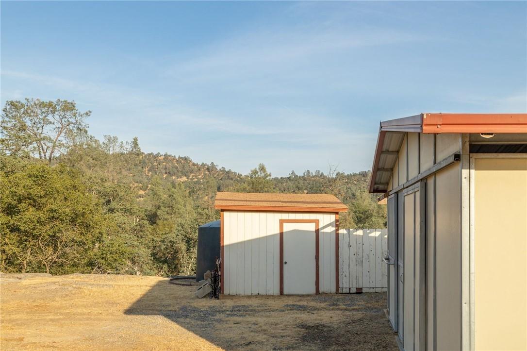 32057 River Knolls Road Coarsegold, CA 93614 - Photo 34 of 73 a view of a house with a outdoor space