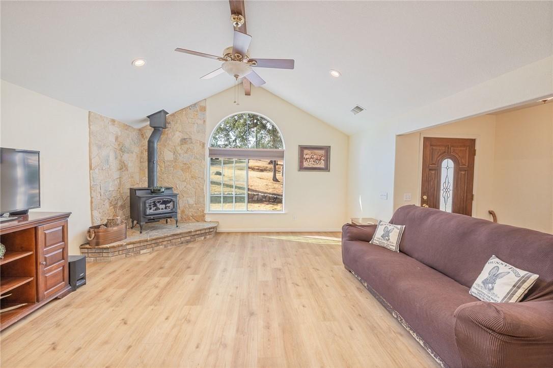 32057 River Knolls Road Coarsegold, CA 93614 - Photo 50 of 73 a living room with furniture and a flat screen tv
