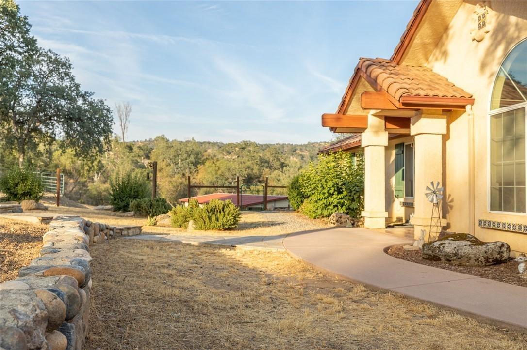 32057 River Knolls Road Coarsegold, CA 93614 - Photo 52 of 73 a view of a house with a outdoor space