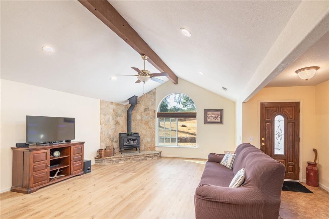 32057 River Knolls Road Coarsegold, CA 93614 - Photo 57 of 73 a living room with furniture and a flat screen tv