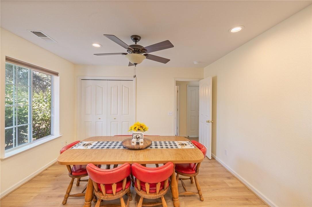 32057 River Knolls Road Coarsegold, CA 93614 - Photo 59 of 73 a view of a dining room with furniture and a window