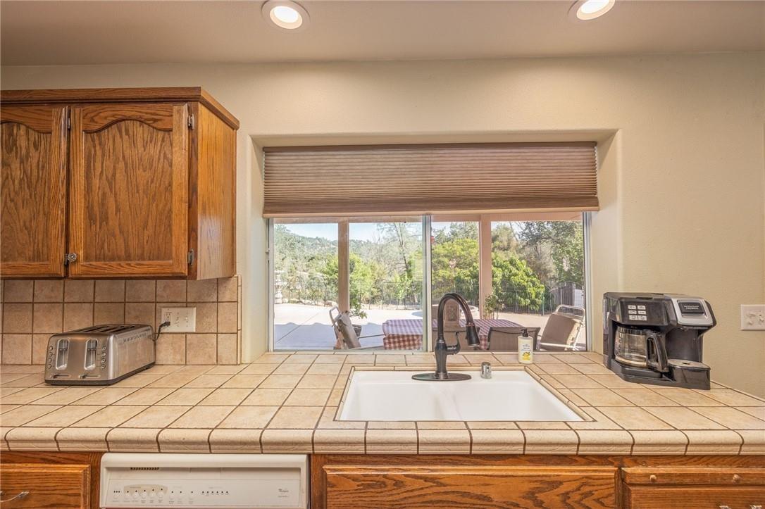 32057 River Knolls Road Coarsegold, CA 93614 - Photo 60 of 73 a living room with a bed and furniture