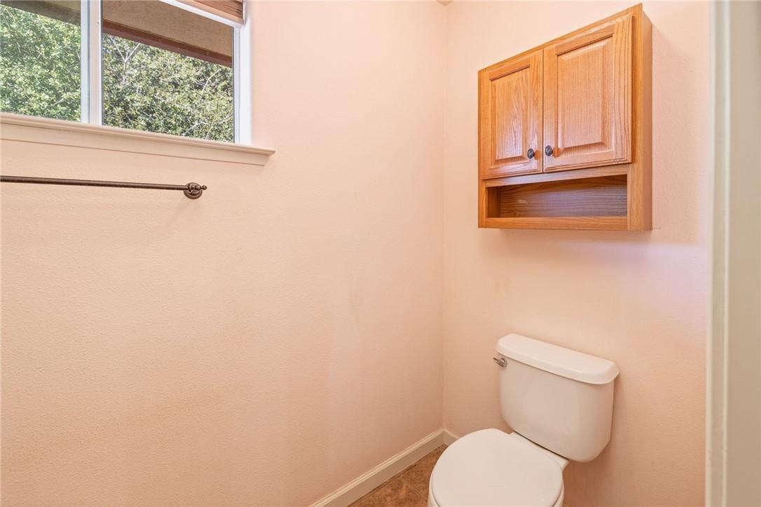 32057 River Knolls Road Coarsegold, CA 93614 - Photo 69 of 73 a white toilet sitting next to a window