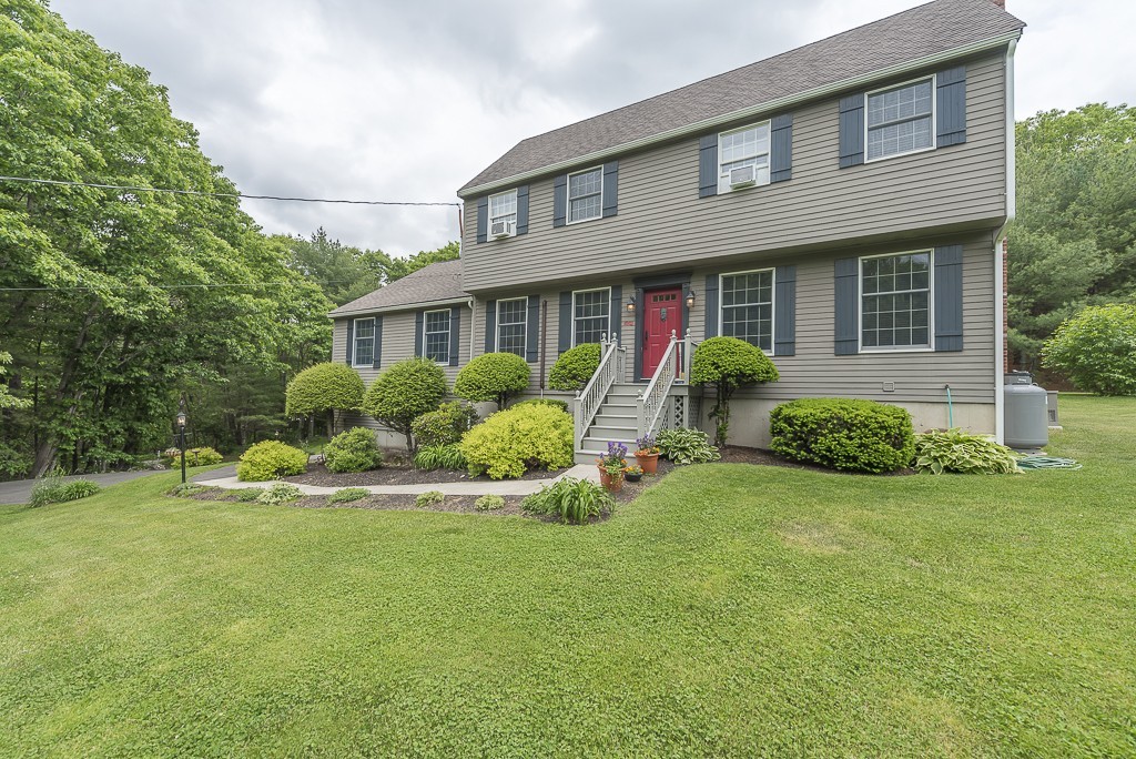 21 Pingree Farm Road Georgetown, MA 01833 - Photo 1 of 30 a front view of a house with a yard and porch
