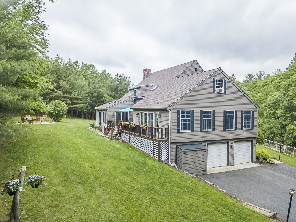 21 Pingree Farm Road Georgetown, MA 01833 - Photo 24 of 30 a front view of a house with a yard
