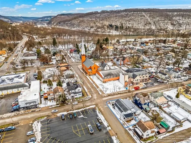 an aerial view of residential building and parking space