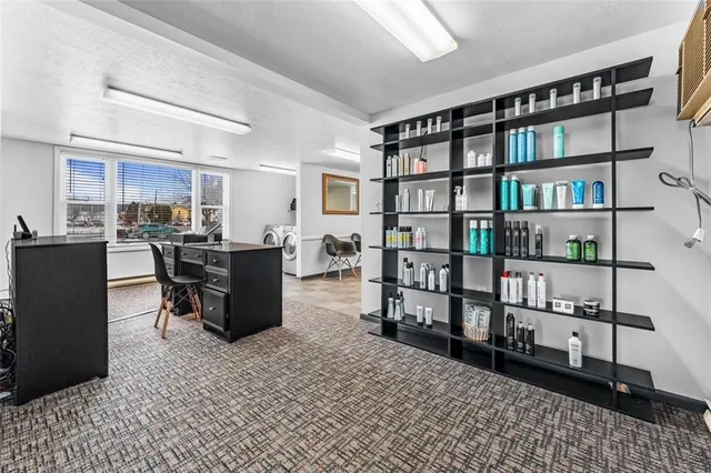 a view of a workspace with furniture