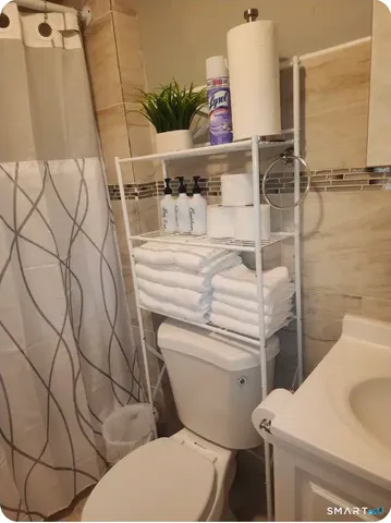 a bathroom with a toilet and a sink
