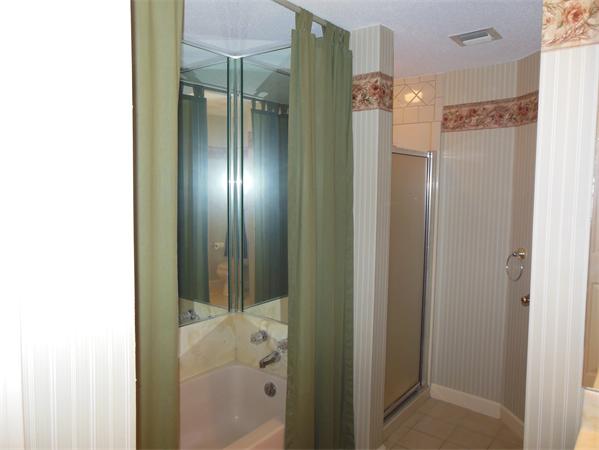 2 Shady Brook, Unit 2 West Springfield, MA 01089 - Photo 15 of 28 a bathroom with a glass shower door and a mirror