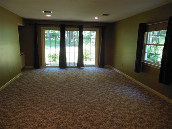 2 Shady Brook, Unit 2 West Springfield, MA 01089 - Photo 17 of 28 a view of an empty room with a fireplace and a window
