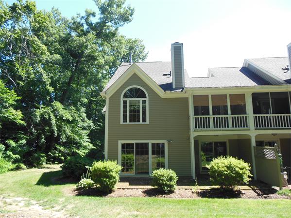 2 Shady Brook, Unit 2 West Springfield, MA 01089 - Photo 24 of 28 a front view of a house with a yard and garage