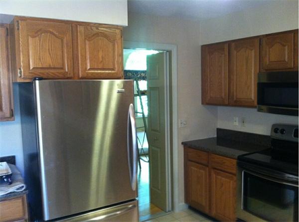 2 Shady Brook, Unit 2 West Springfield, MA 01089 - Photo 7 of 28 a kitchen with stainless steel appliances granite countertop a refrigerator and a stove top oven