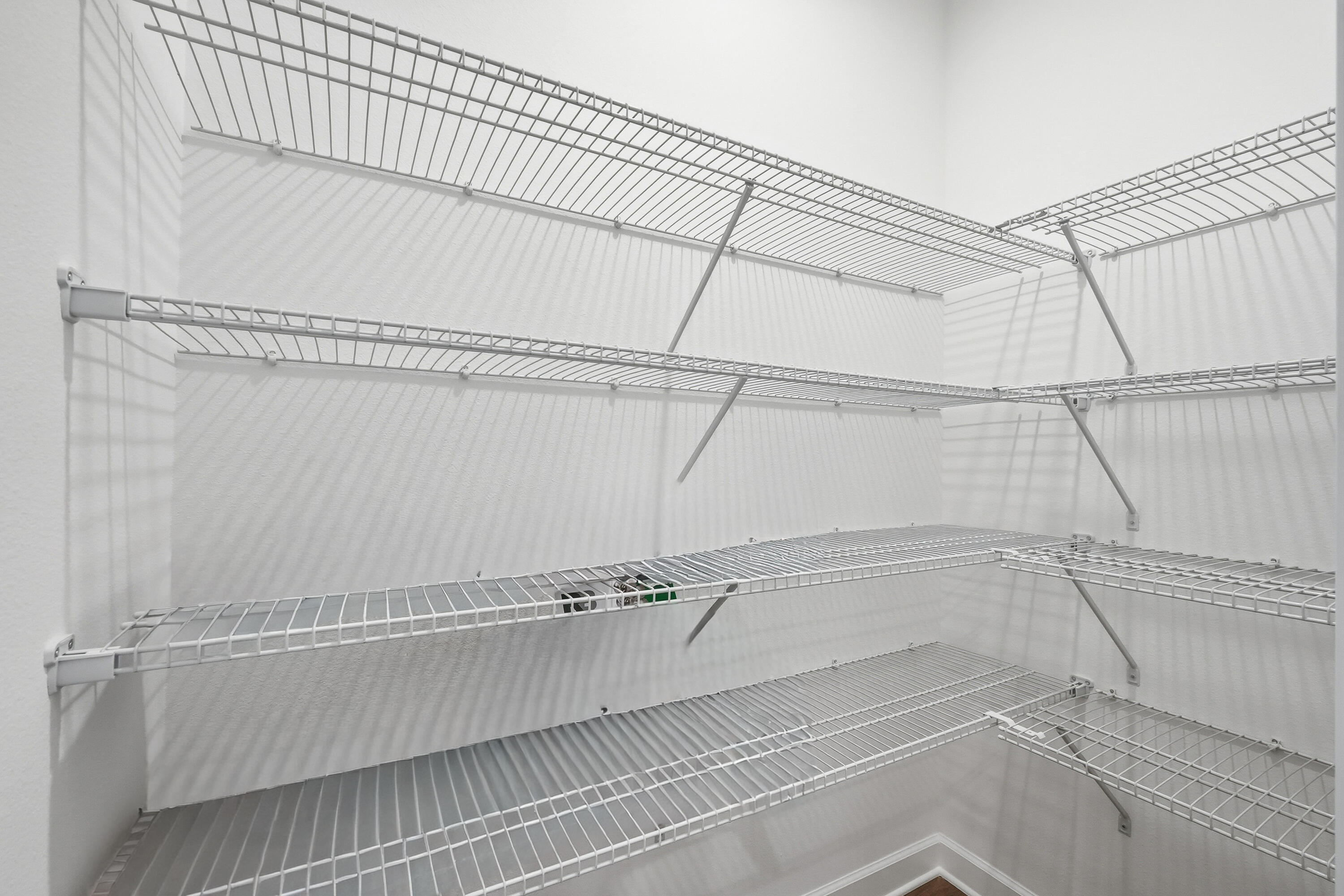 6105 Mildreds Way Crestview, FL 32539 - Photo 12 of 28 a view of a room with racks on the wall