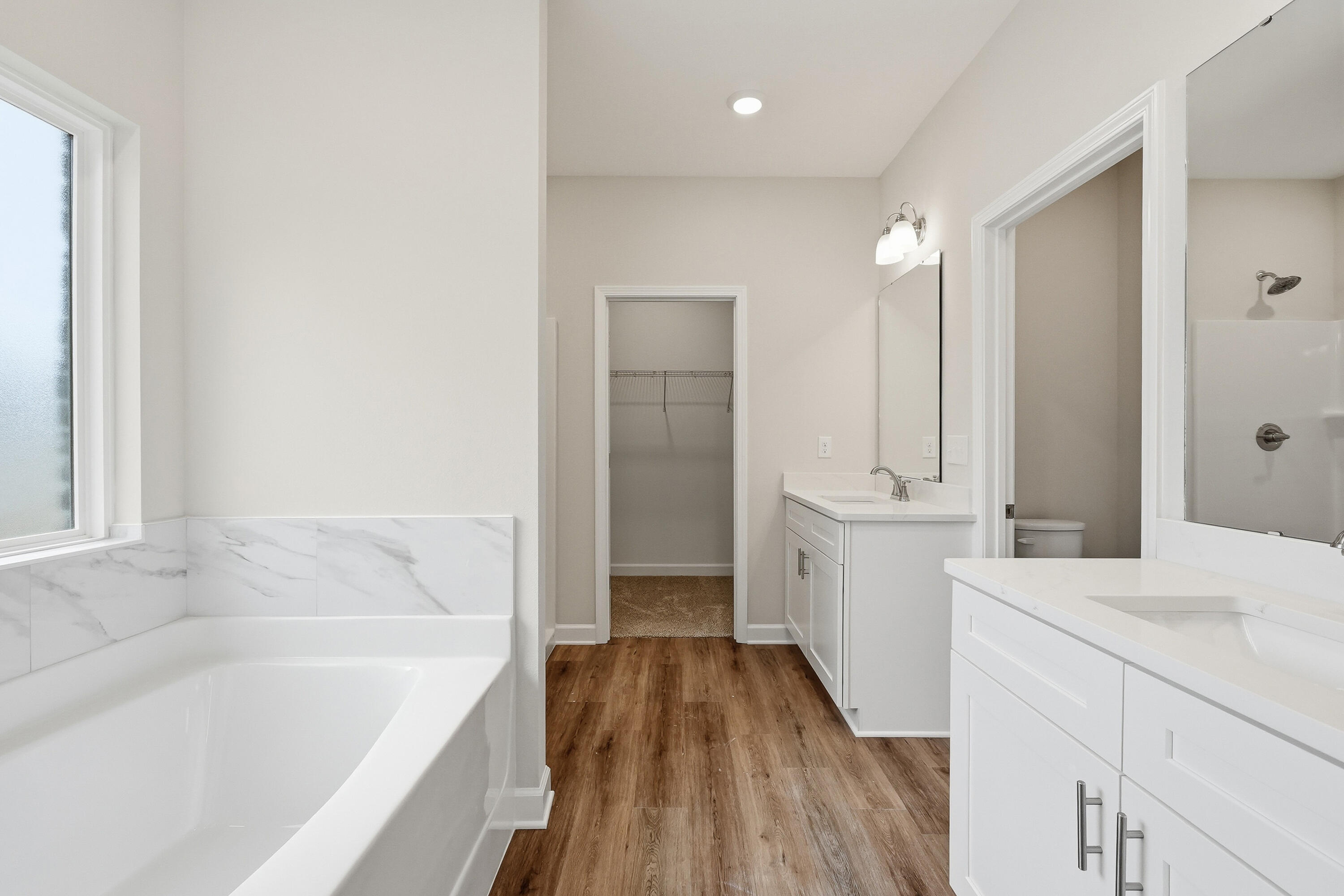 6105 Mildreds Way Crestview, FL 32539 - Photo 15 of 28 a bathroom with a sink a mirror and a bathtub