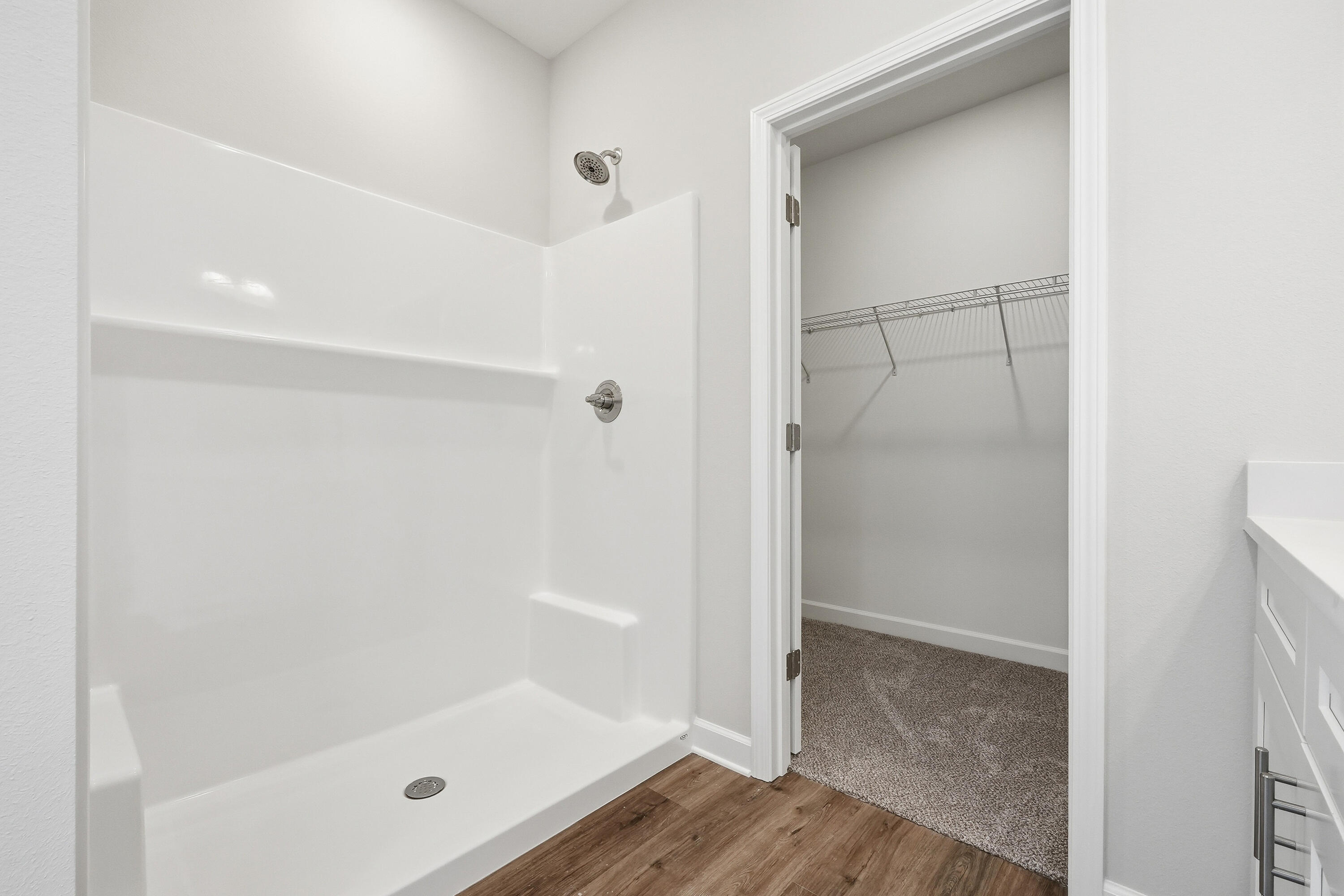 6105 Mildreds Way Crestview, FL 32539 - Photo 17 of 28 a bathroom with a glass shower door