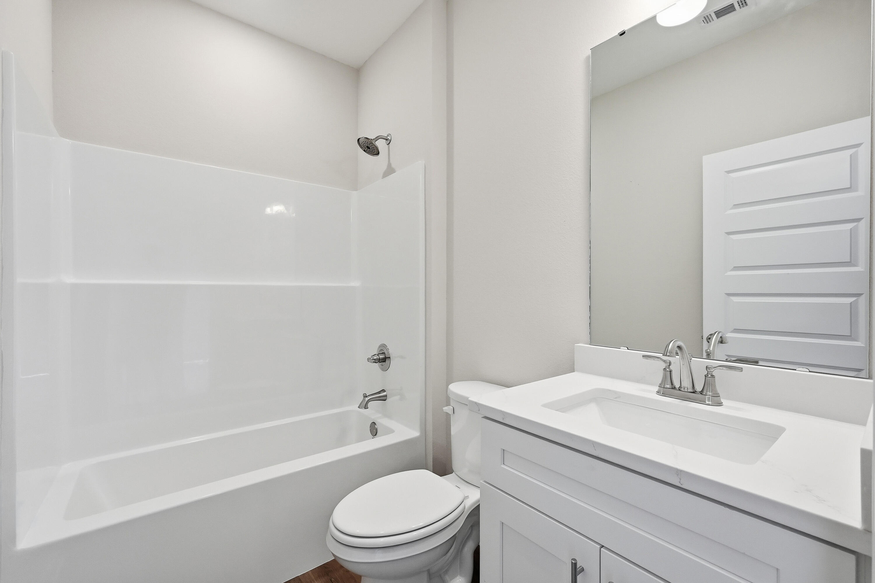 6105 Mildreds Way Crestview, FL 32539 - Photo 20 of 28 a bathroom with a sink a toilet and a bathtub
