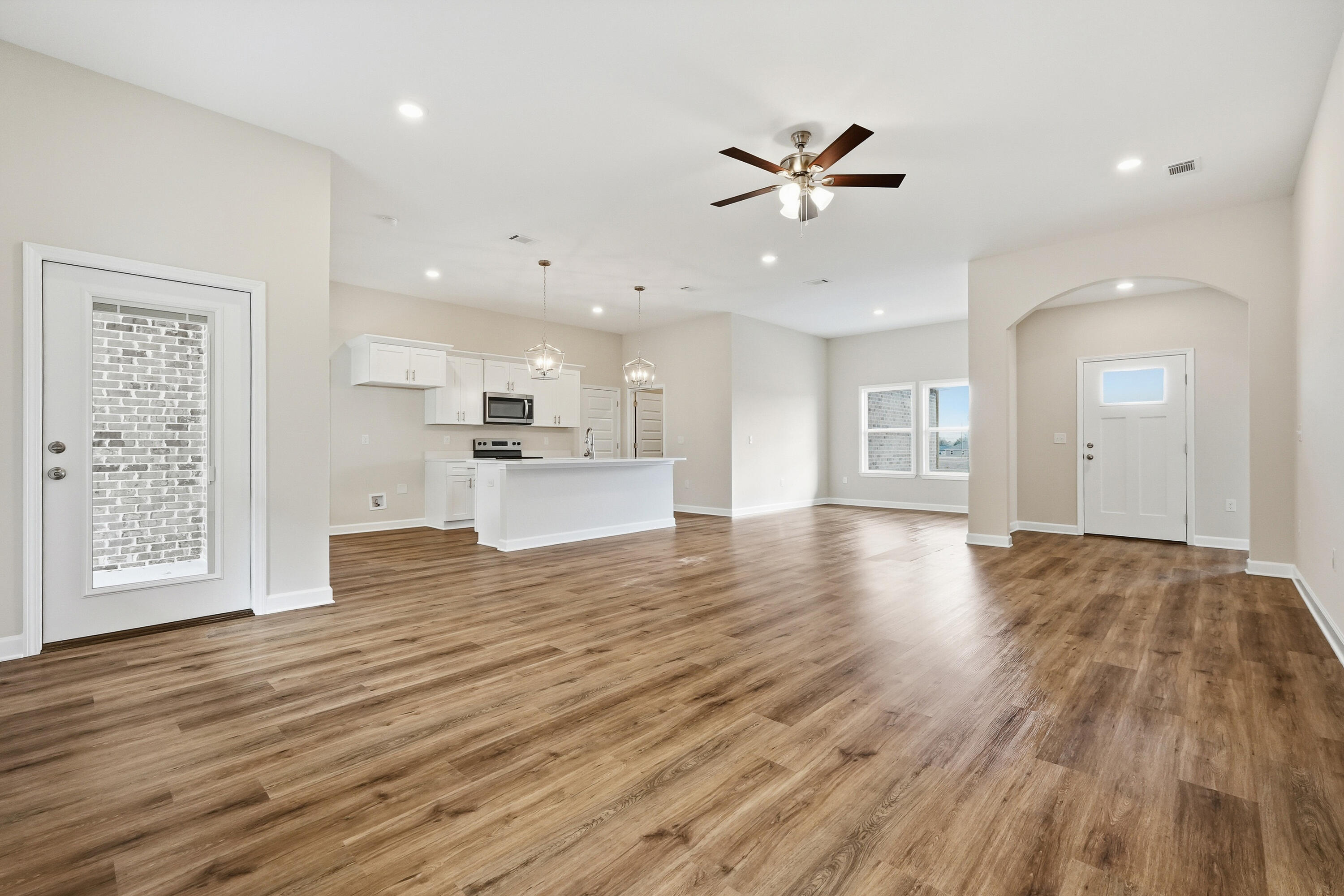 6105 Mildreds Way Crestview, FL 32539 - Photo 4 of 28 a view of a kitchen with a dishwasher cabinets and wooden floor