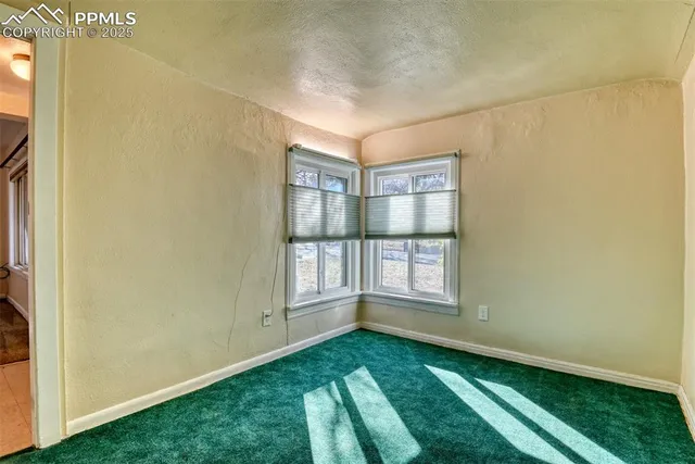 a bathroom with a shower a toilet and a sink