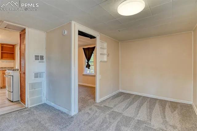 a kitchen with granite countertop cabinets and window