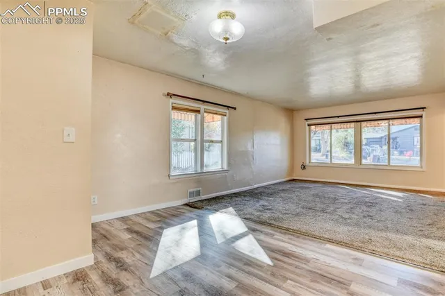a view of a room with a sink and closet