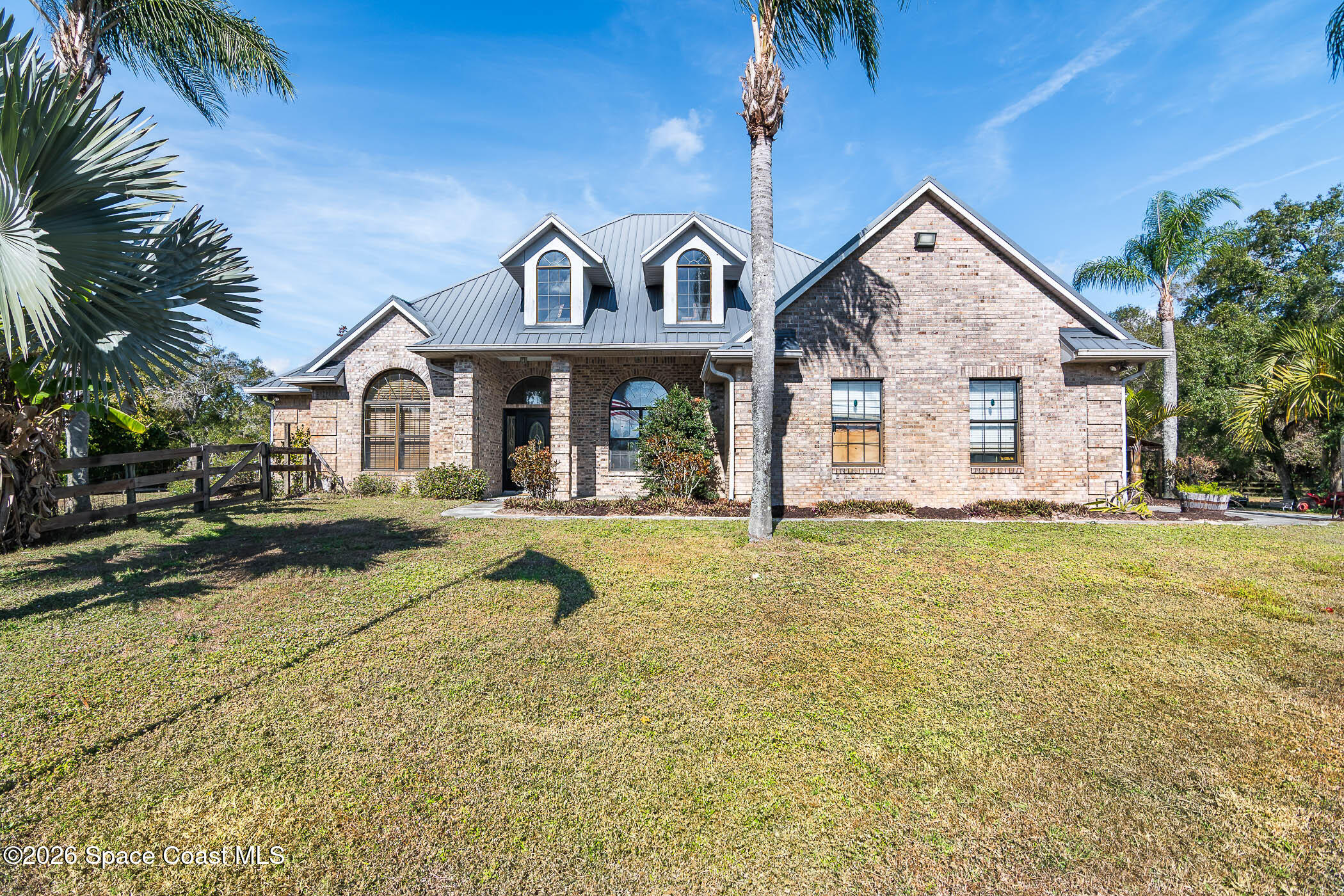 5101 Craig Road Cocoa, FL 32926 - Photo 1 of 62 a front view of a house with a yard
