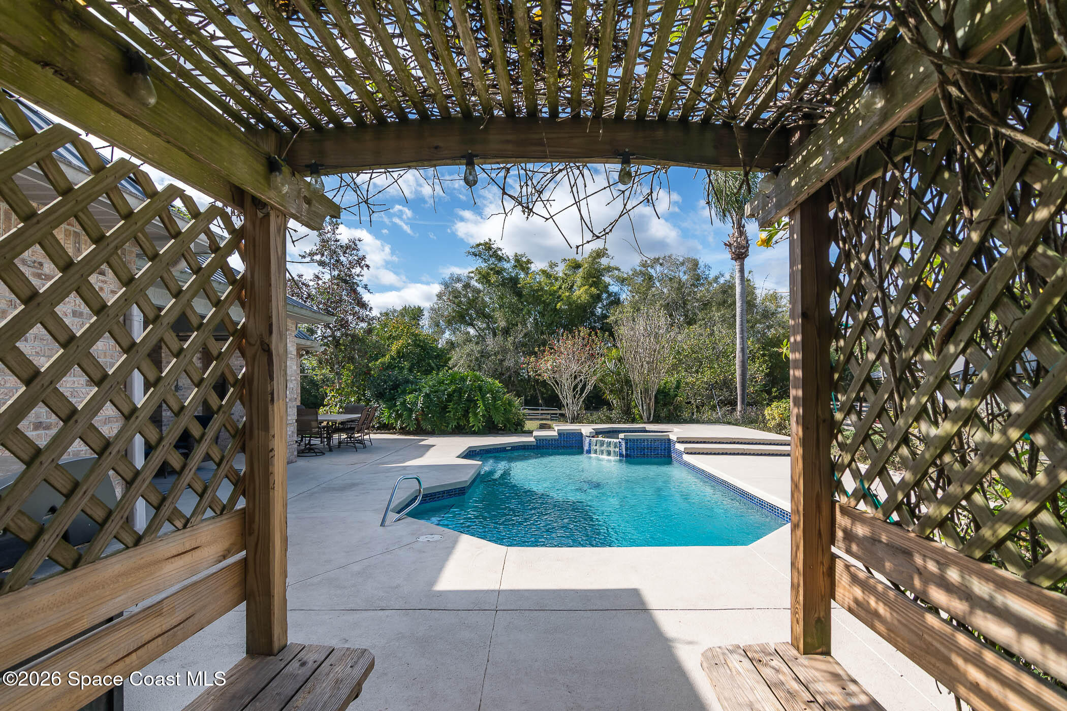 5101 Craig Road Cocoa, FL 32926 - Photo 30 of 62 a view of a swimming pool with a patio