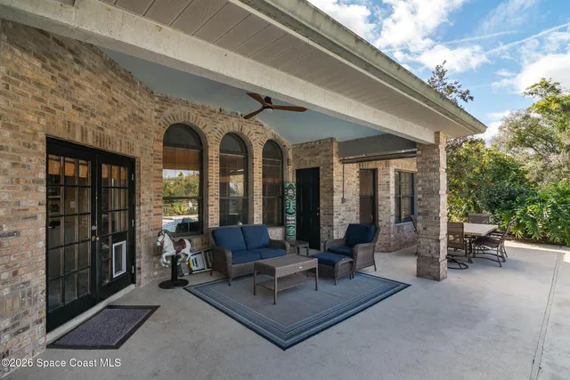 a kitchen with stainless steel appliances granite countertop a sink a stove and a wooden cabinets