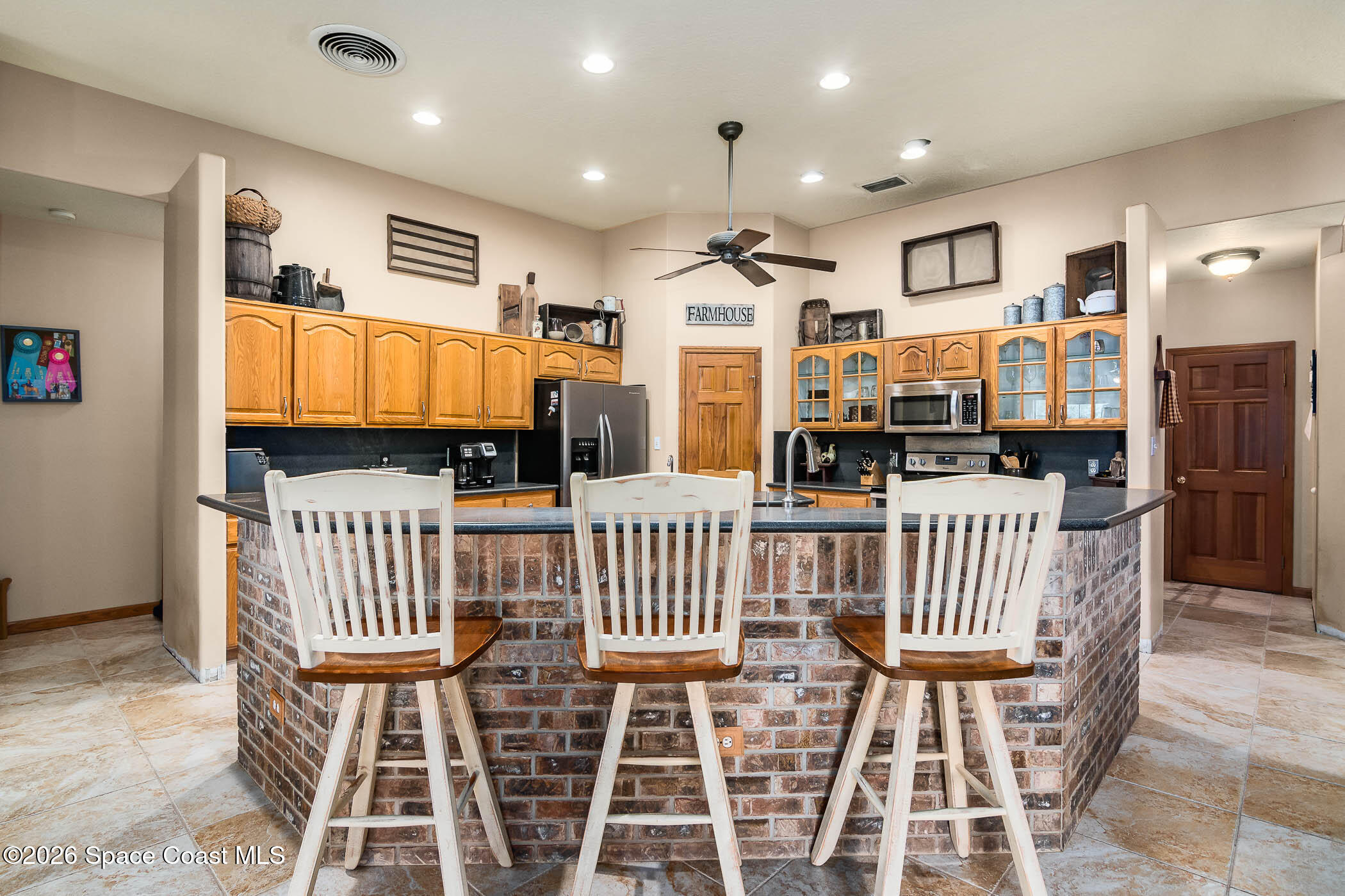 5101 Craig Road Cocoa, FL 32926 - Photo 36 of 62 a bedroom with furniture a flat screen tv and chairs