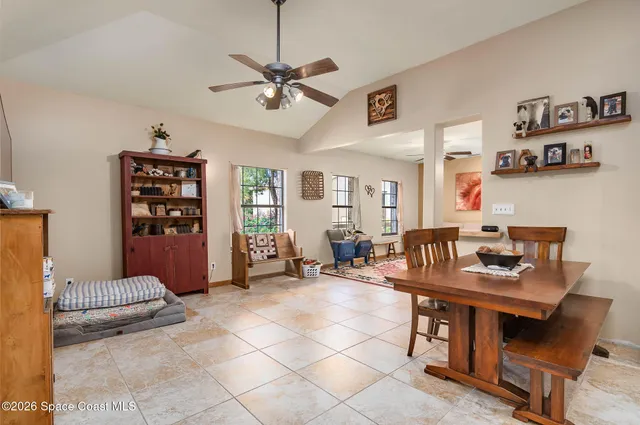 a living room with furniture and flat screen tv