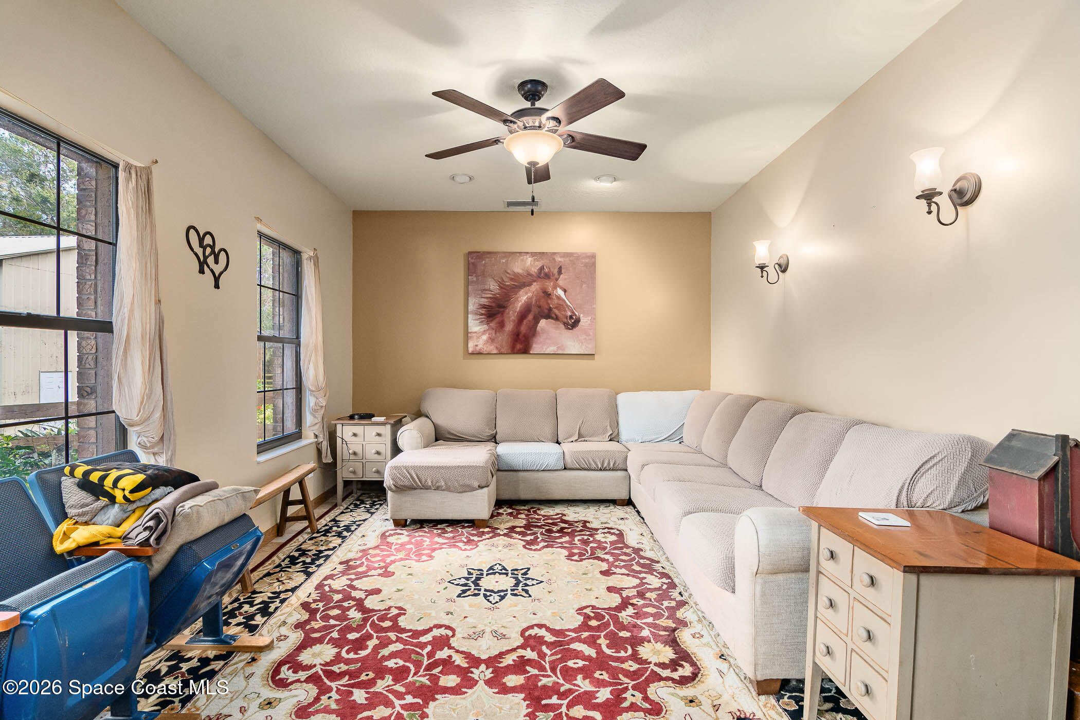 5101 Craig Road Cocoa, FL 32926 - Photo 40 of 62 a living room with furniture and painting on the wall