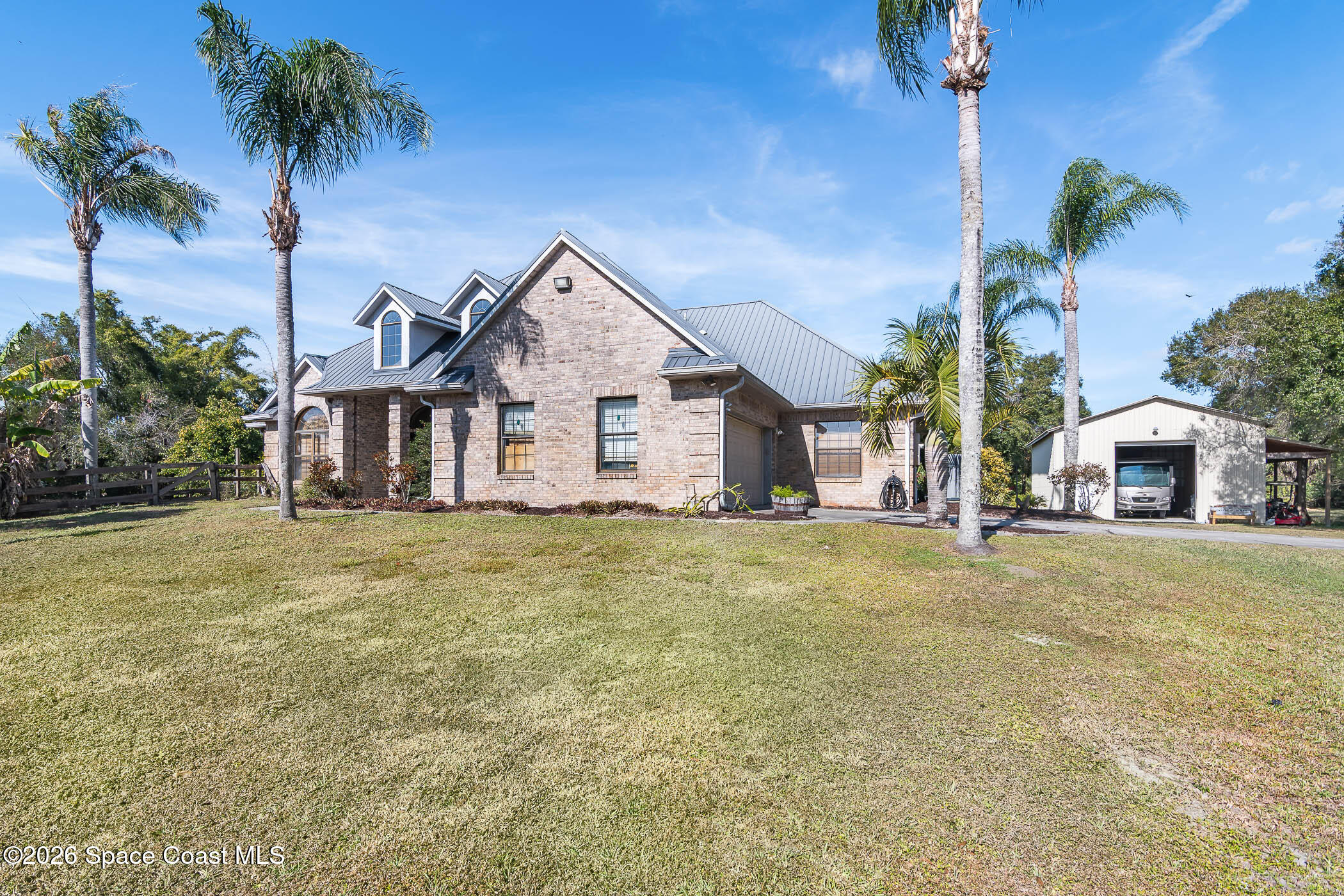 5101 Craig Road Cocoa, FL 32926 - Photo 4 of 62 a view of a house with a backyard and a tree