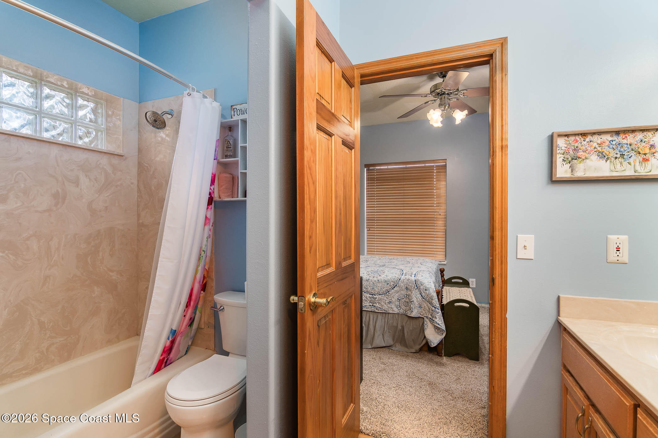 5101 Craig Road Cocoa, FL 32926 - Photo 51 of 62 a bathroom with a toilet a sink and shower