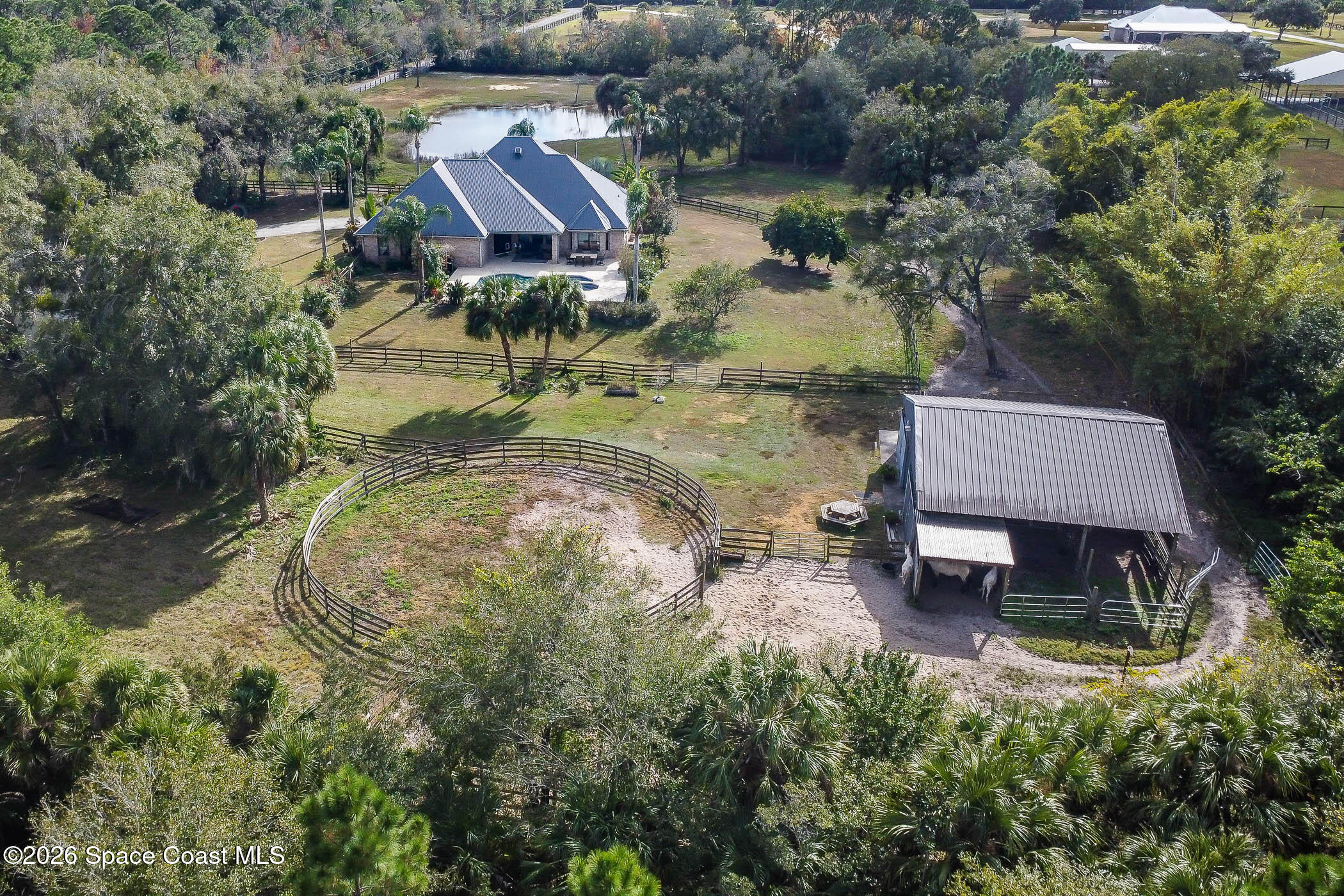 5101 Craig Road Cocoa, FL 32926 - Photo 60 of 62 an aerial view of a house with outdoor space and a lake view in back