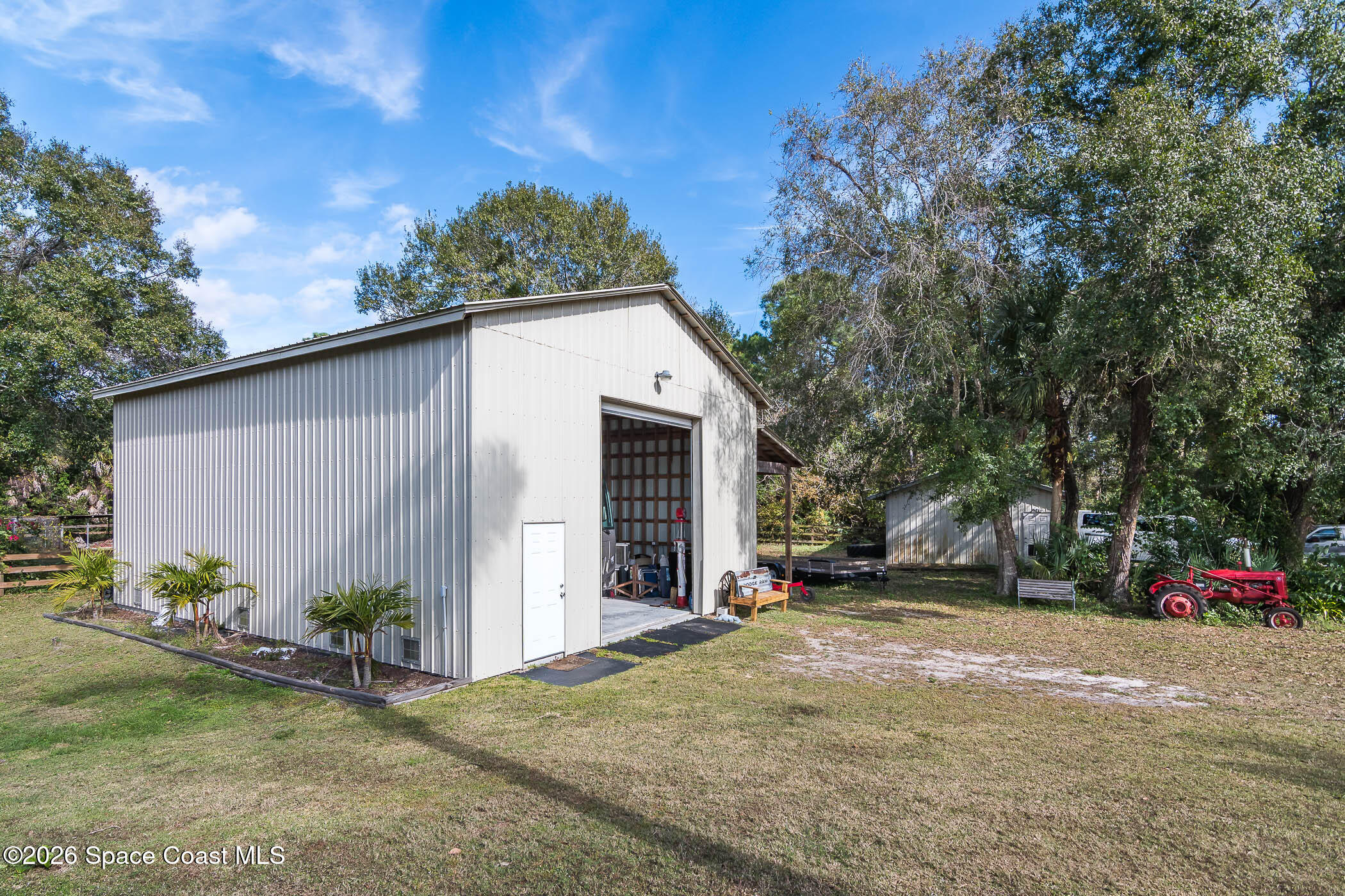 5101 Craig Road Cocoa, FL 32926 - Photo 8 of 62 a view of a house with a yard and garage