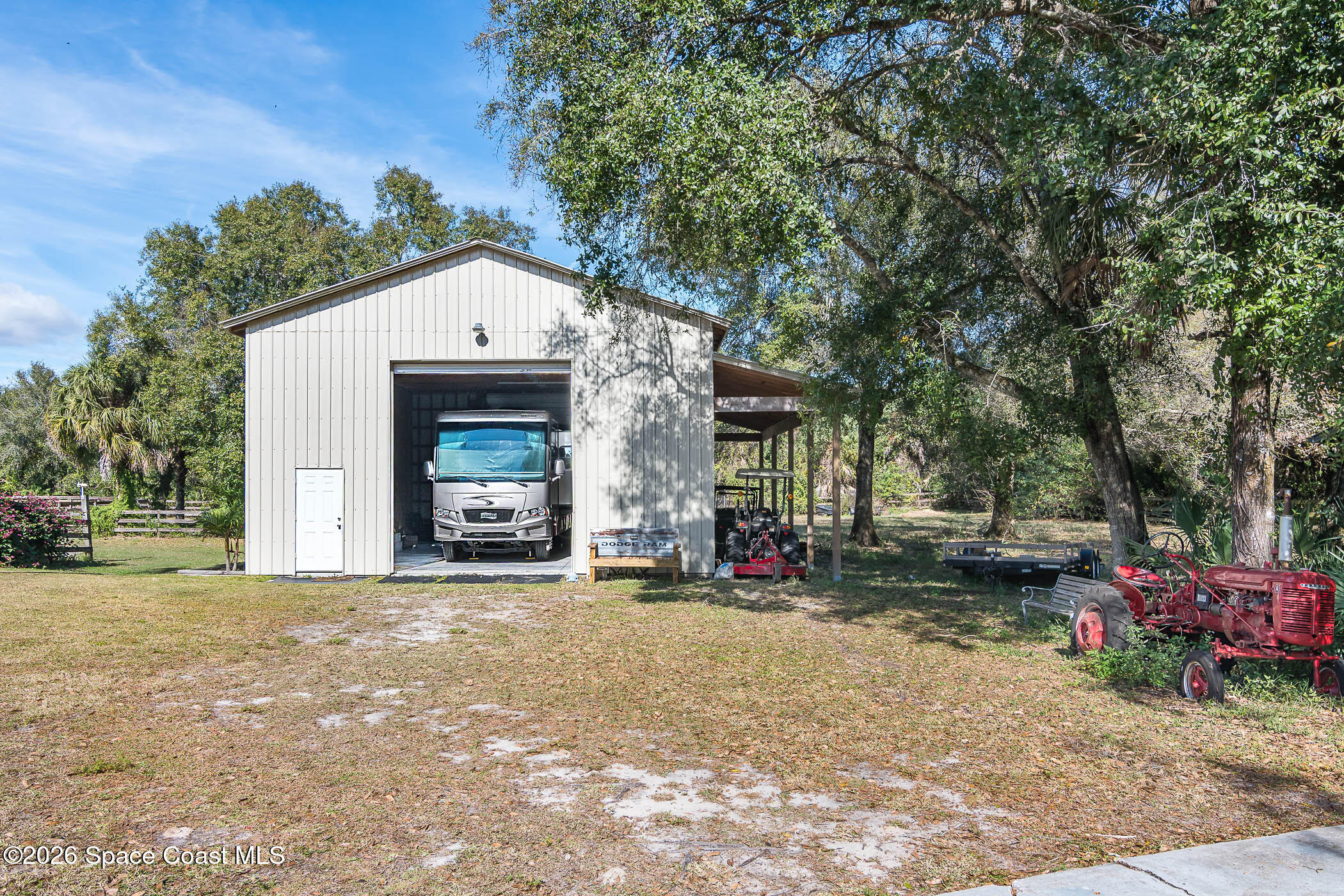 5101 Craig Road Cocoa, FL 32926 - Photo 10 of 62 a view of a house with a yard and sitting area